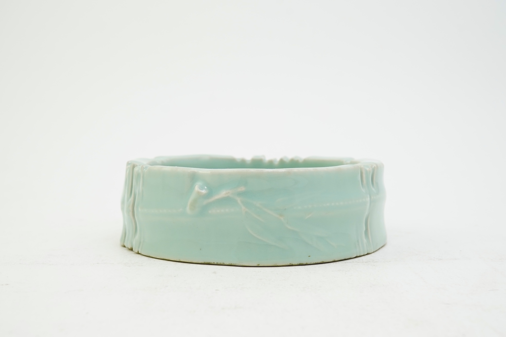 A Chinese celadon glazed brushwasher, Qianlong mark but later
